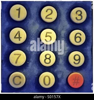 Number dialing phone on a public telephone dial Stock Photo