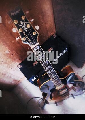 Semi-acoustic jazz guitar with amplifier. Stock Photo