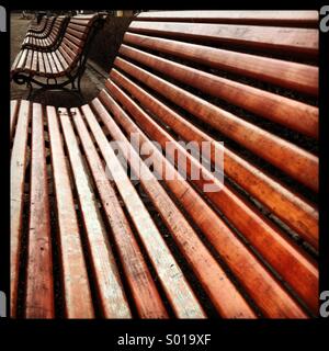 Empty city park benches on a cold day Stock Photo