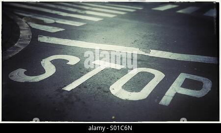 Stop sign on asphalt Stock Photo