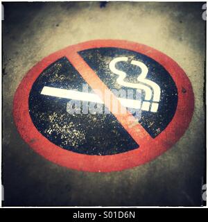 No smoking sign on pavement Stock Photo