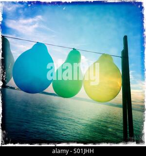 Balloons on wire Stock Photo