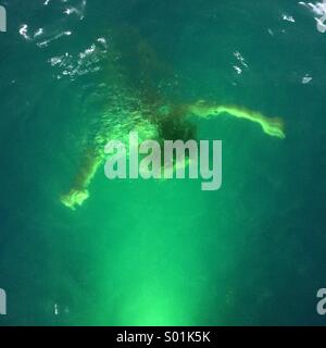 Woman under water Stock Photo