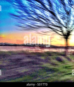 Wind turbine from moving car Stock Photo