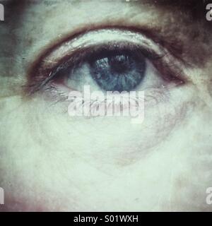 Blue eye of middle aged woman Stock Photo