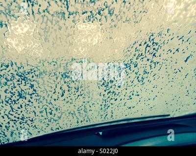 Going through the car wash - foam on the windscreen Stock Photo