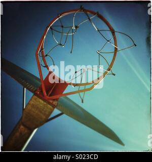 Basketball hoop on a clear blue sky Stock Photo