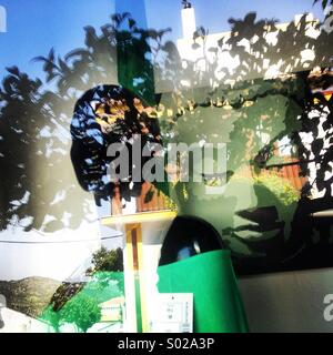 An image of Budha decorates a shop window in Prado del Rey, Cadiz, Andalusia, Spain Stock Photo