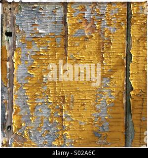 Wooden panel with peeling paint for background Stock Photo