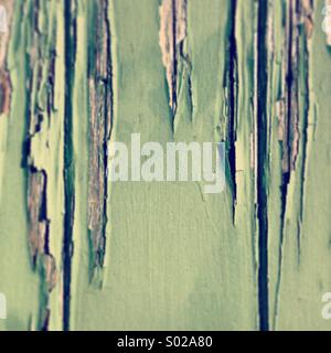 Old peeling pale green paint texture on wood Stock Photo
