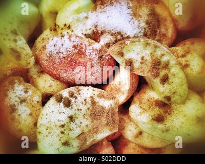 Apples with sugar and cinnamon, making cider Stock Photo