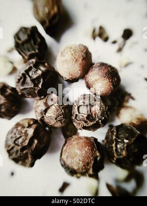 Black peppercorns, macro Stock Photo
