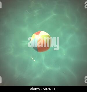Beach ball in swimming pool Stock Photo