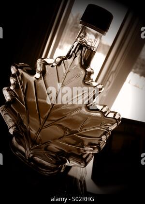 Canadian Maple Syrup glass Bottle in the shape of a maple leaf Stock Photo