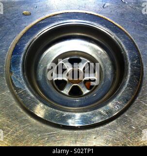 Stainless steel kitchen sink plug hole Stock Photo