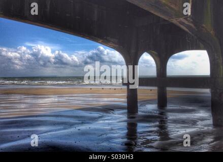 A View of Bournemouth West Beach from under the pier on a Sunny day, UK Stock Photo
