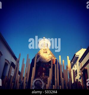 The sun illuminated an image of the Virgin of the Dulce Nombre ( Holy Name) is displayed during Easter Palm Sunday in Prado del Rey, Sierra de Cadiz, Andalusia, Spain Stock Photo
