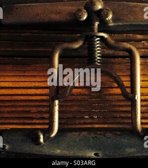 Metal clasp mechanism detail from an antique photograph album with gilded pages and leather cover Stock Photo