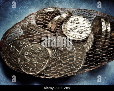 Chocolate coins in a net Stock Photo