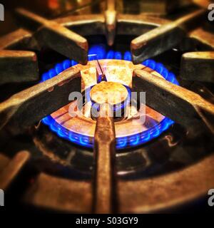 Gas range with blue flame. Stock Photo