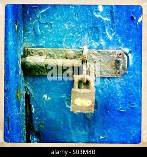 Padlock and bolted gate Stock Photo