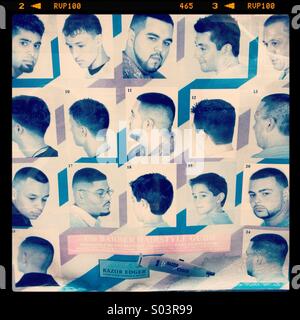 Faded poster of haircut styles in the window of barbershop Stock Photo