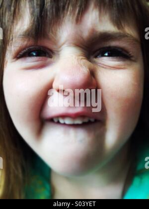 Silly Caucasian smiling goofy face girl Stock Photo