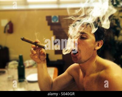 Smoking a Cuban cigar Stock Photo