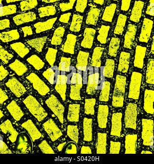 Two feet on the yellow brick road Stock Photo