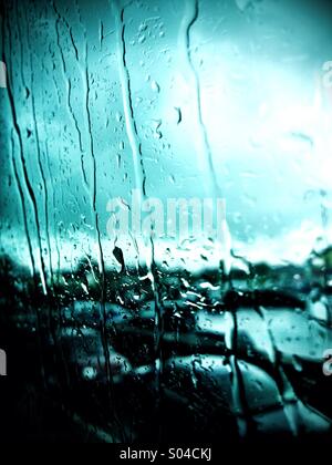 Rain on bus window in traffic Stock Photo