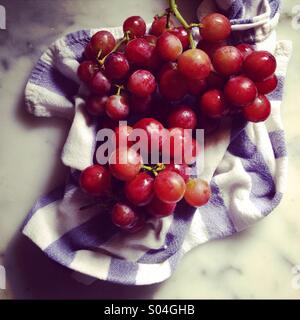 Grapes on tea towel Stock Photo