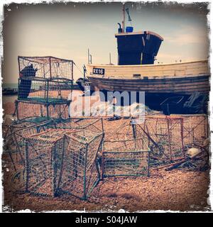 Crab pots and Fishing Boats on Hastings Beach, East Sussex, England,UK Stock Photo
