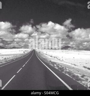 Road leading to mountains on Lanzarote Stock Photo