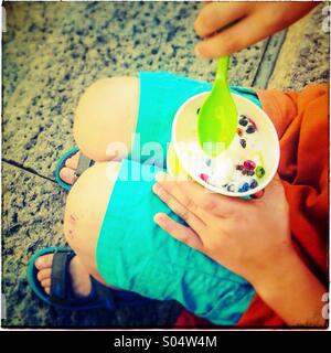 Boy eating ice cream in Barcelona Stock Photo