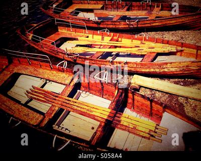 Moored rowing boats on Derwent Water in Lake District Stock Photo