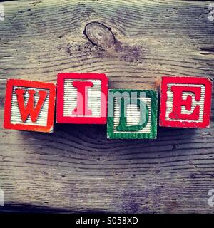 It's a photo of four wood cubes toy with letters that form the word Stock Photo