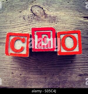It's a photo of wood blocks toy with letters that form the acronym word CEO Stock Photo