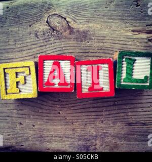 It's a photo of few wood blocks with colored letters on them that are combined together to create the word FAIL Stock Photo