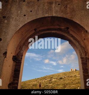 The desert seen from a window of the ruins of a mine in Real de Catorce, San Luis Potosi, Mexico Stock Photo