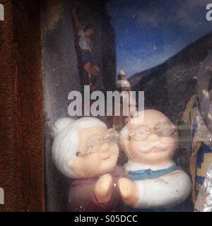 Dolls of a couple of elderly people decorate a window in Real de Catorce, San Luis Potosi, Mexico Stock Photo