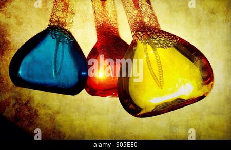 Bottles of coloured soap solution Stock Photo