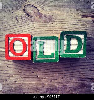 It's a photo of few wood blocks with letter on them that are combined together to create the word OLD Stock Photo