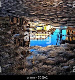 Puddle reflection in Rome Italy Stock Photo