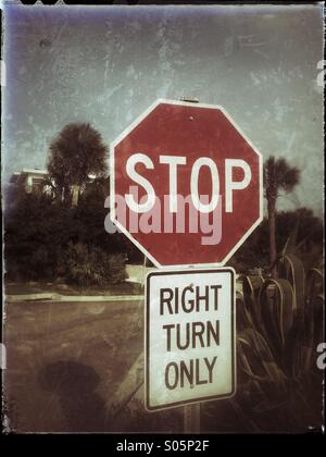 Stop, right turn only road sign. Stock Photo