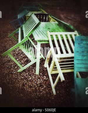 Outdoor seating at a seaside cafe is abandoned due to rotten English summer weather Stock Photo
