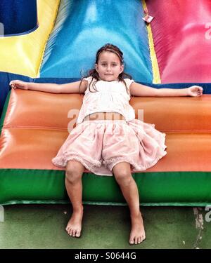Girl on bouncy castle Stock Photo