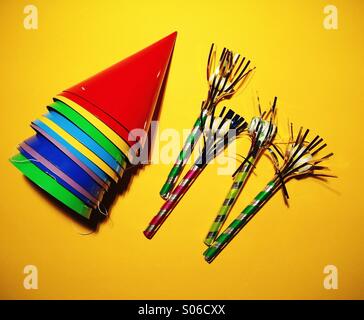 Party favours on a yellow background Stock Photo