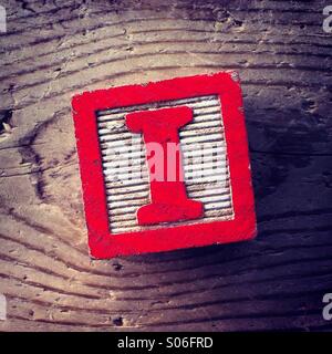 It's a woodblock toy with an alphabet letter on it: I Stock Photo