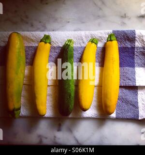 Zucchini on tea towel Stock Photo