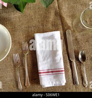Place setting on burlap Stock Photo